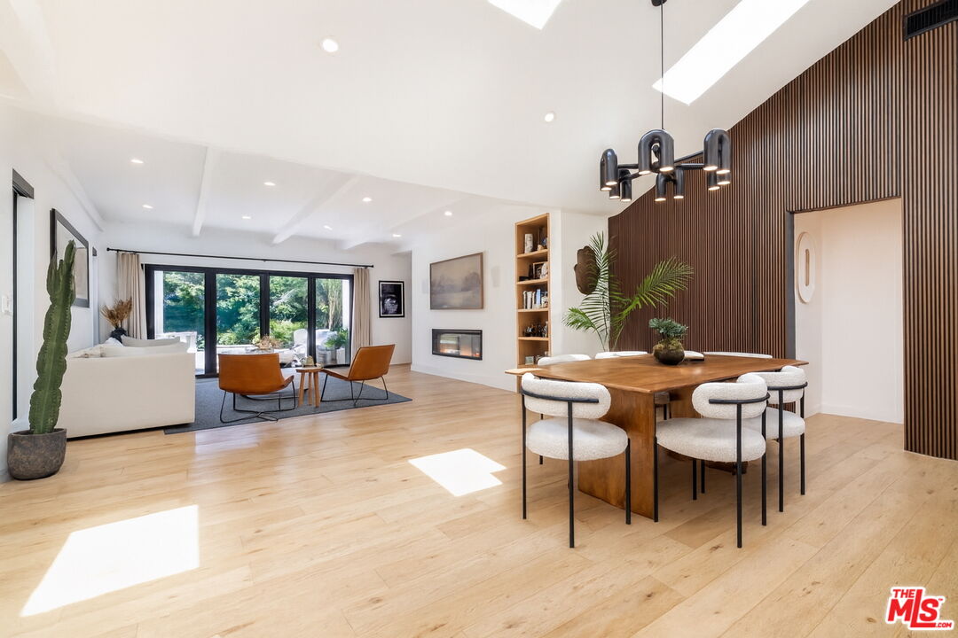 a view of a dining room with furniture and a livingroom