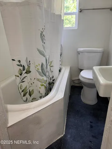 a bathroom with a toilet and a sink