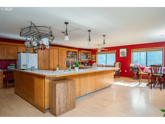 a kitchen with stainless steel appliances granite countertop a sink and cabinets