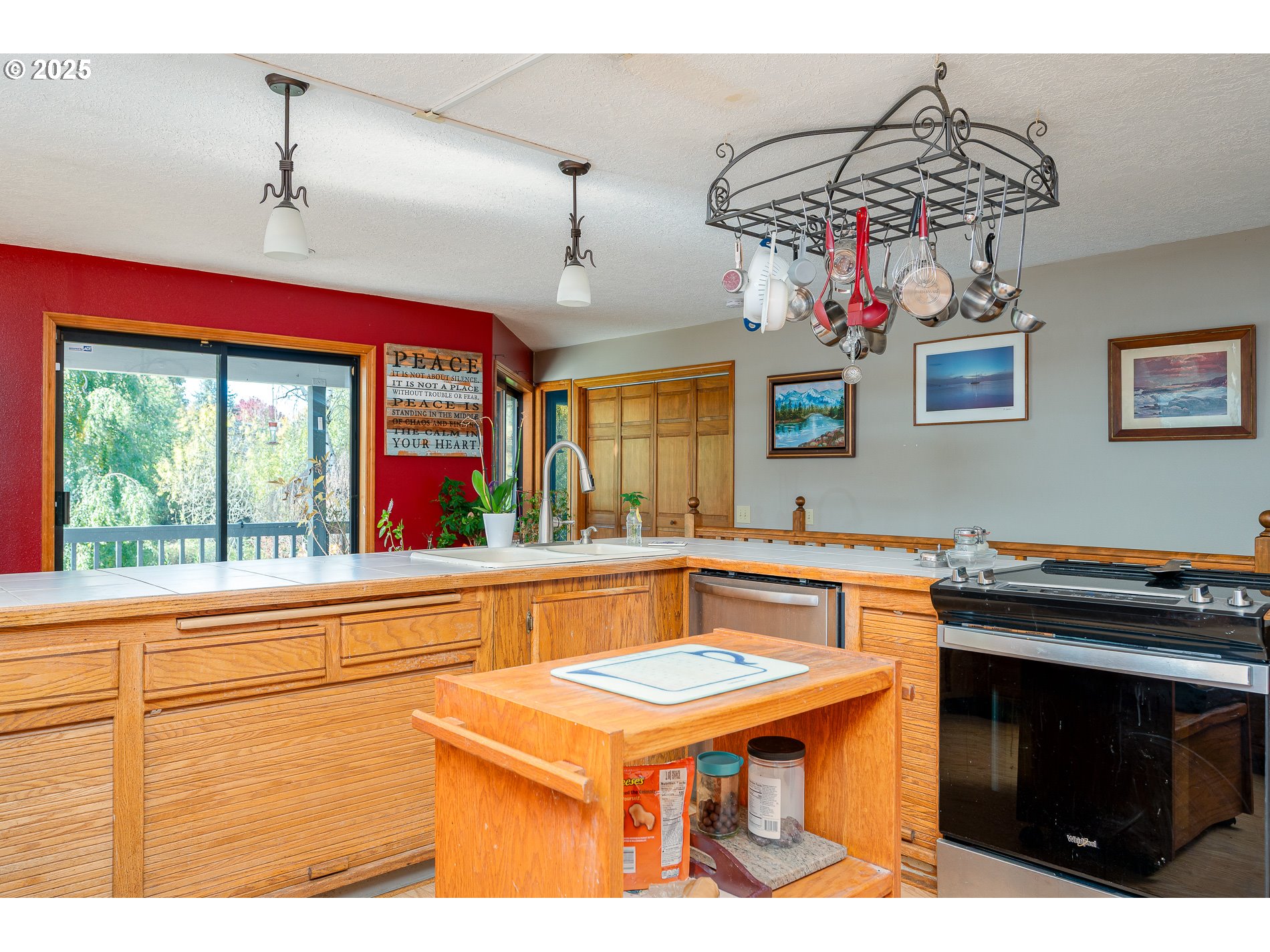 1963 Southwest Myers Place Gresham, OR 97080 - Photo 14 of 43 a kitchen that has a stove and a table in it
