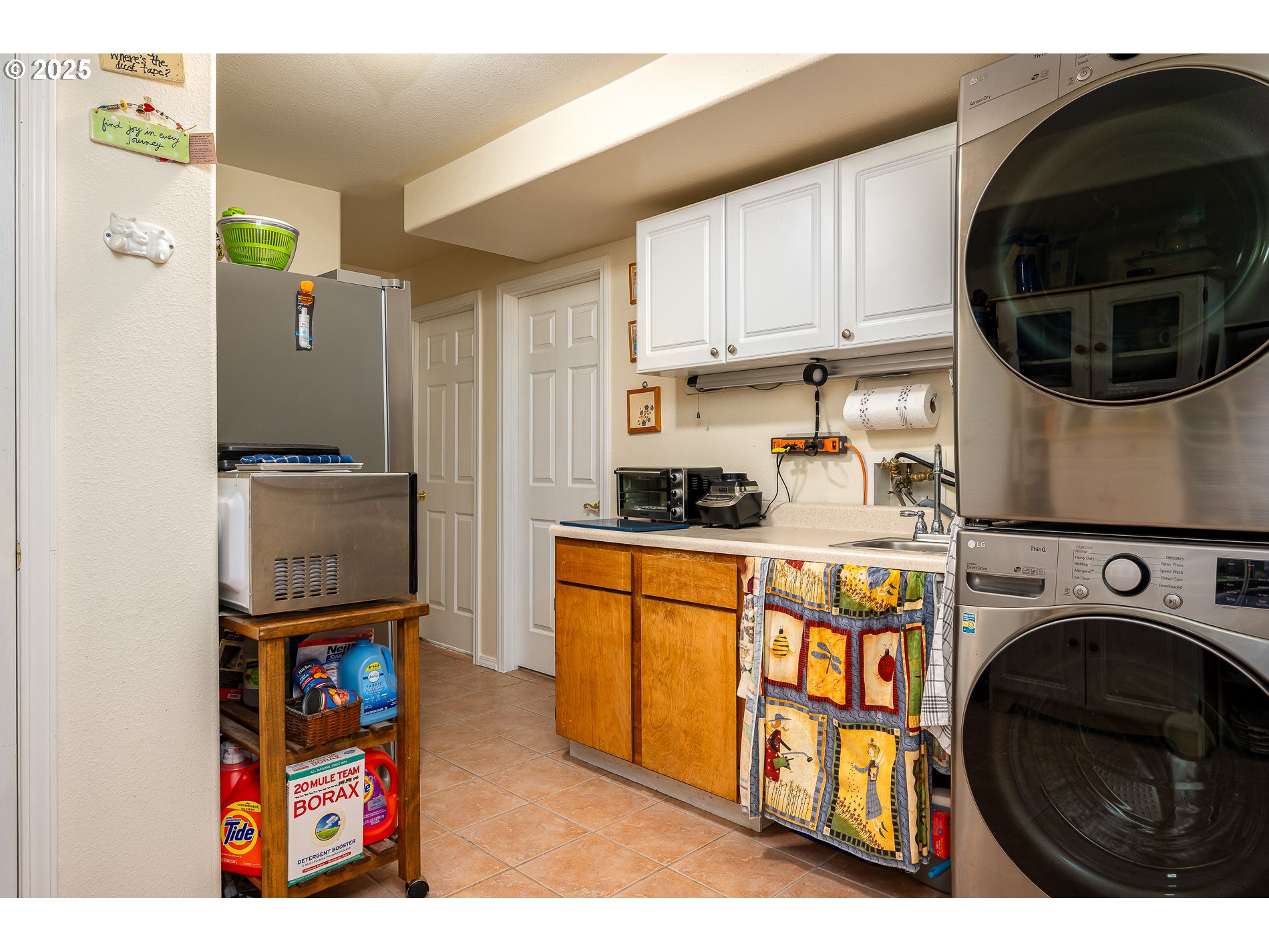 1963 Southwest Myers Place Gresham, OR 97080 - Photo 20 of 43 a kitchen with stainless steel appliances granite countertop a refrigerator a stove and a sink with wooden floor