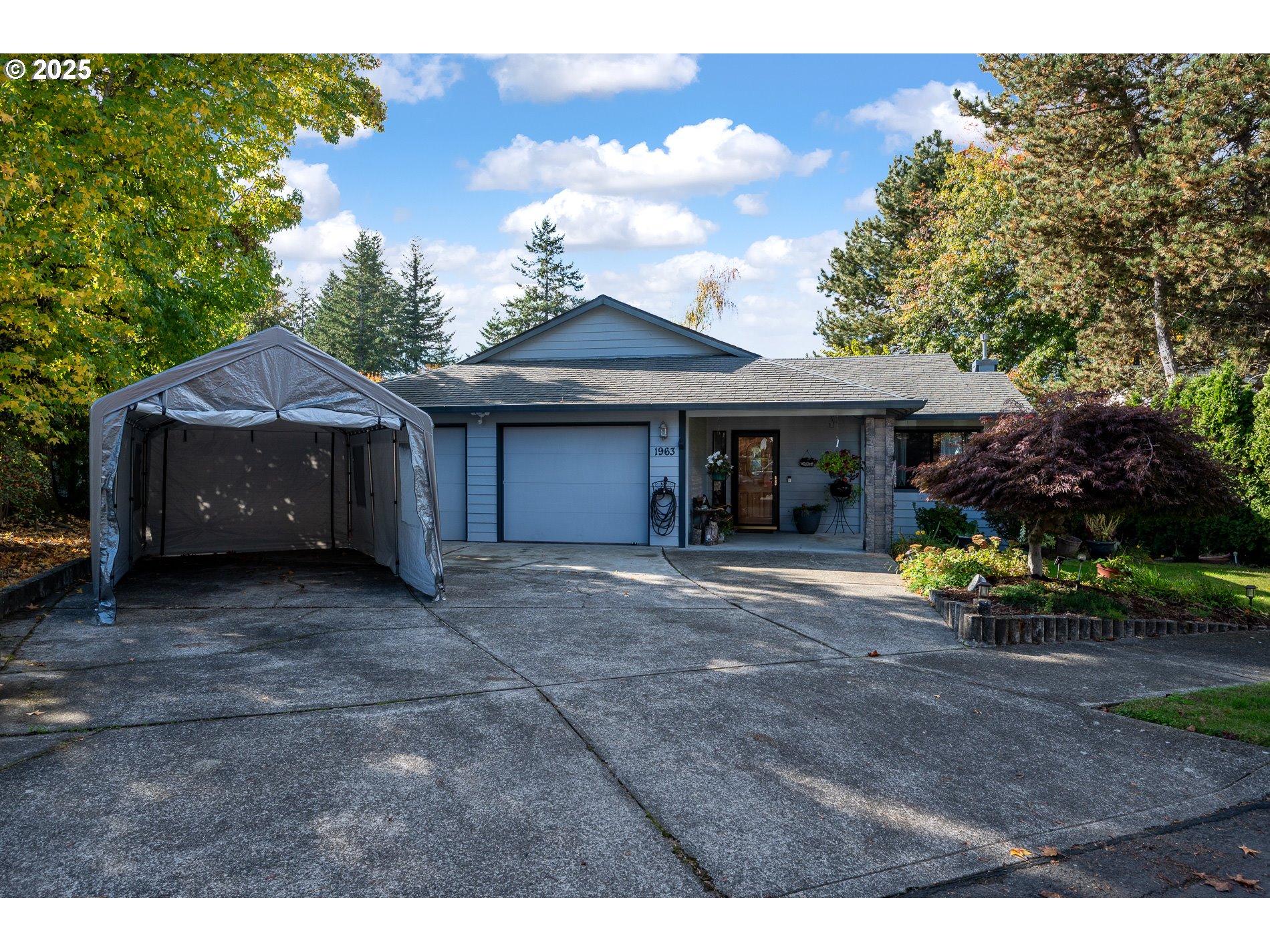 1963 Southwest Myers Place Gresham, OR 97080 - Photo 2 of 43 a front view of a house with porch and garden