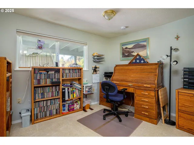 a workspace with furniture and book shelf