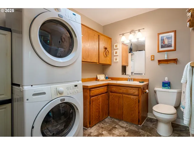a bathroom with a toilet a sink and a mirror