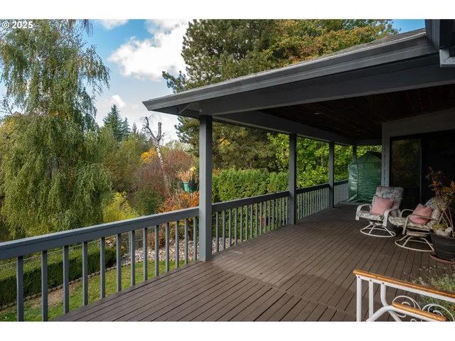a view of a two chairs in the balcony