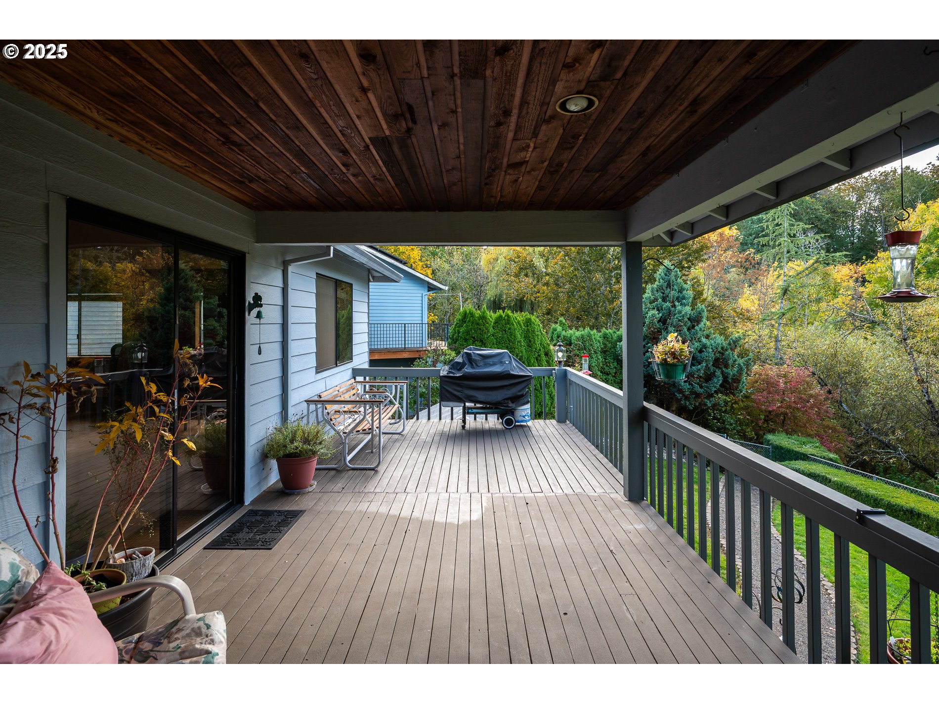 1963 Southwest Myers Place Gresham, OR 97080 - Photo 33 of 43 a view of balcony with chairs and wooden floor
