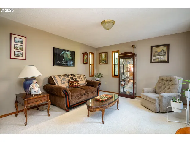 a living room with furniture and a table