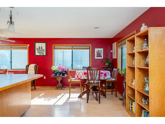 a view of a dining room with furniture and a window