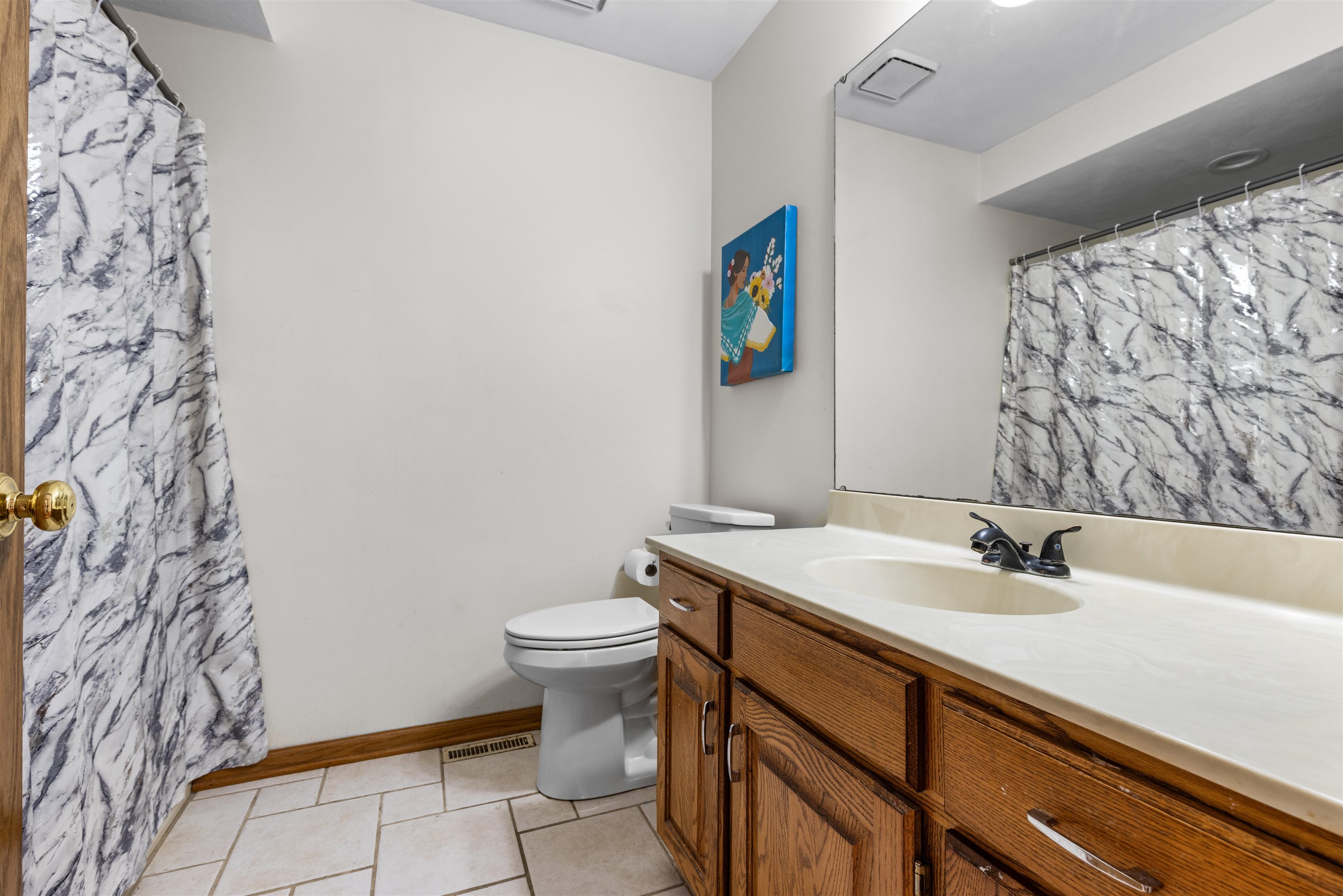 7467 McCurry Road Roscoe, IL 61073 - Photo 12 of 29 a bathroom with a sink and a toilet