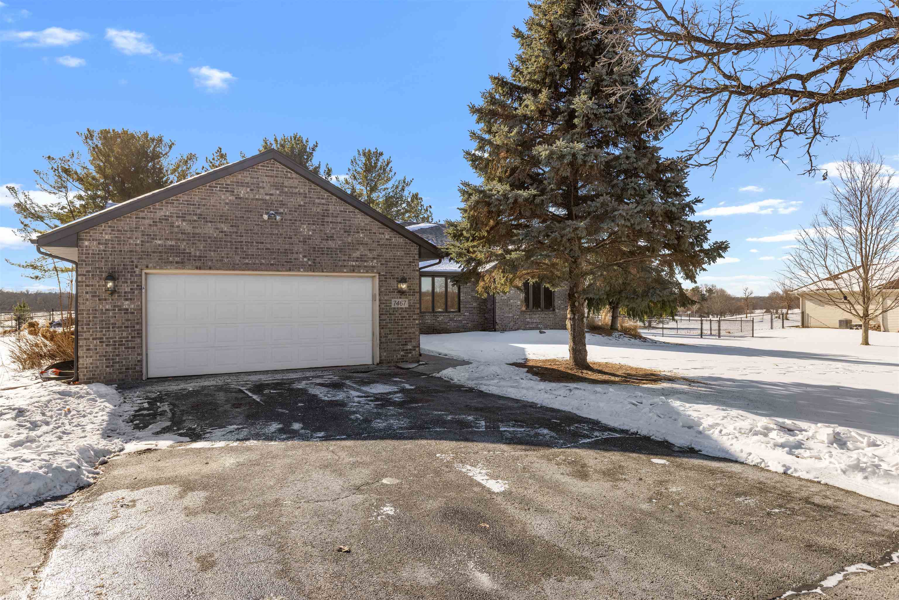 7467 McCurry Road Roscoe, IL 61073 - Photo 17 of 29 a view of a house with a yard