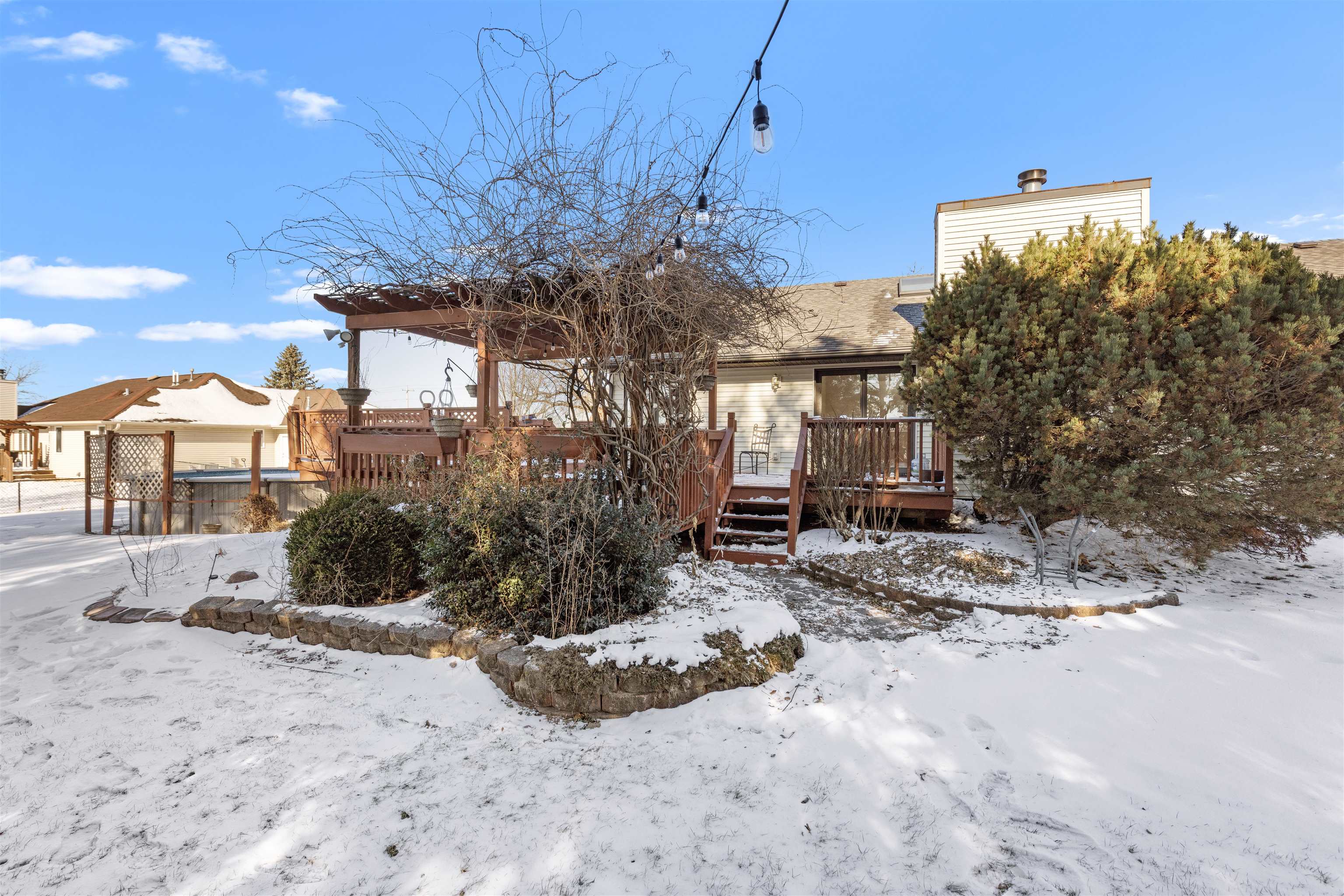 7467 McCurry Road Roscoe, IL 61073 - Photo 21 of 29 a view of a house with a yard and sitting area