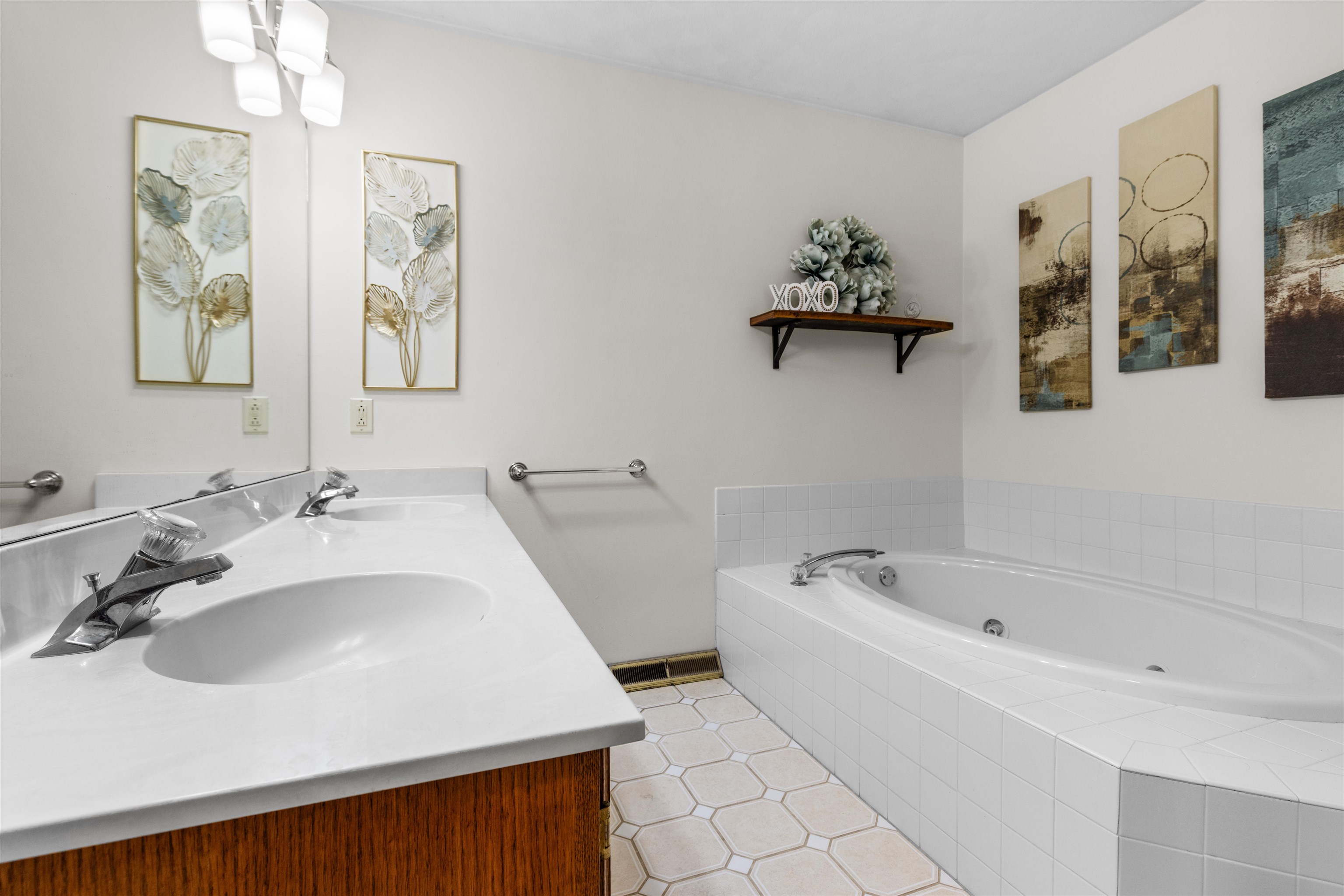 7467 McCurry Road Roscoe, IL 61073 - Photo 9 of 29 a bathroom with a bathtub and a sink