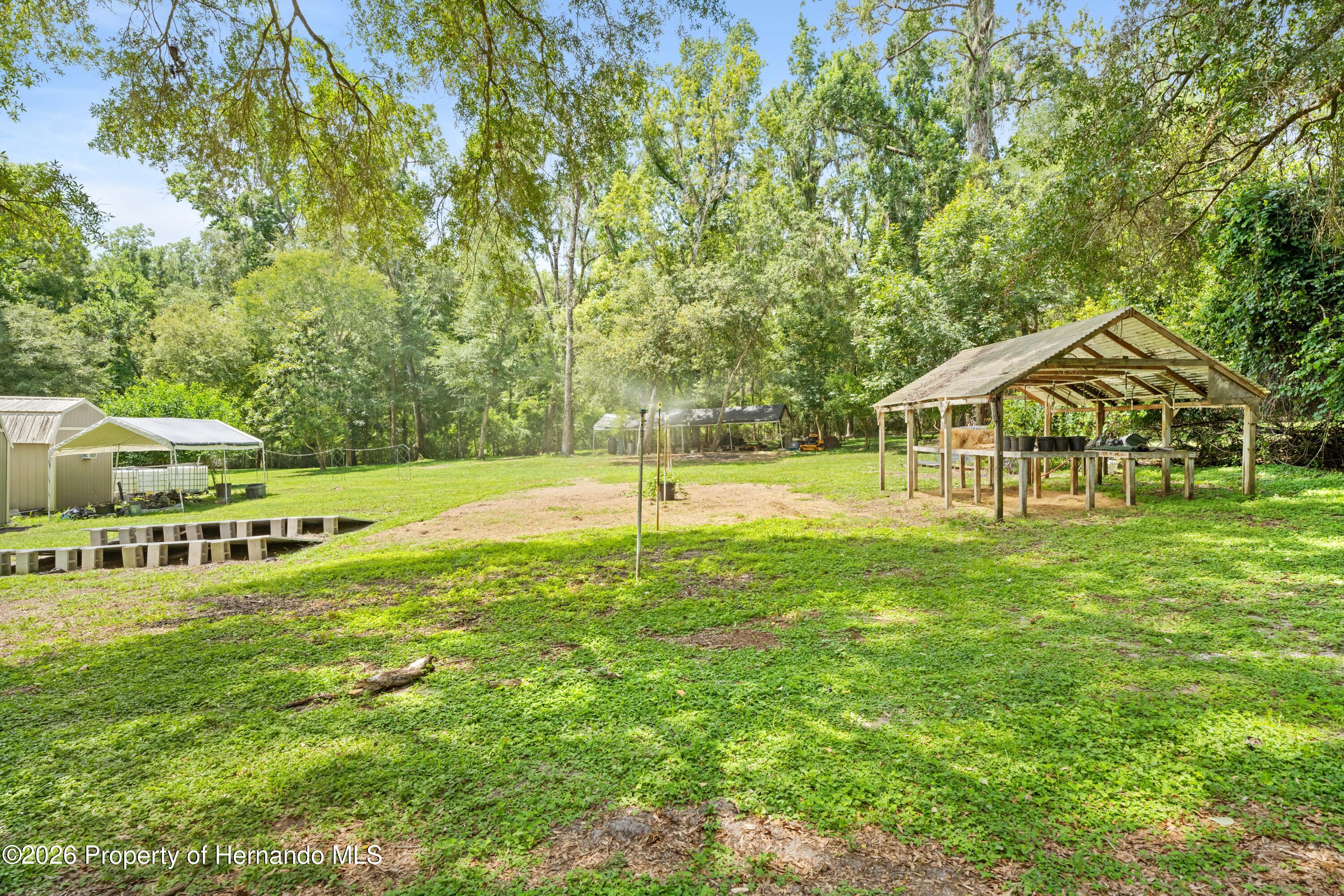 3311 Baseball Pond Road Brooksville, FL 34602 - Photo 11 of 18 a view of a house with a yard and sitting area