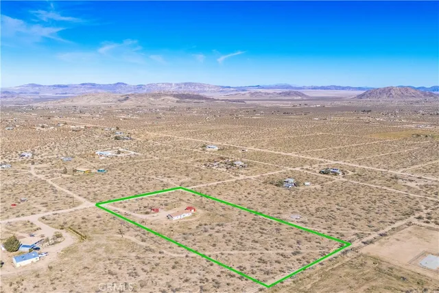 a view of an ocean beach and mountain