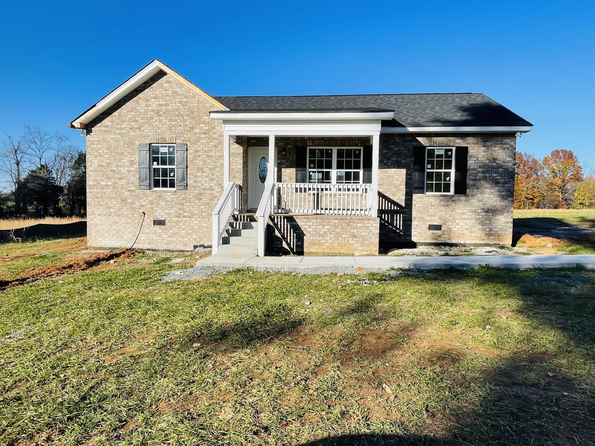 a front view of a house with a yard
