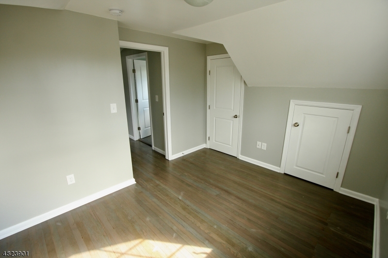 18 William Street, Unit 2 Summit, NJ 07901 - Photo 11 of 15 an empty room with wooden floor and closet