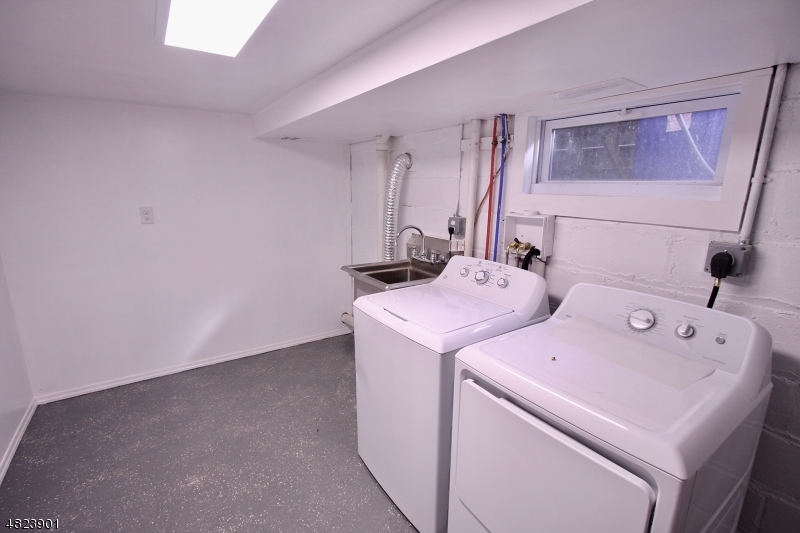 18 William Street, Unit 2 Summit, NJ 07901 - Photo 13 of 15 a utility room with dryer and washer