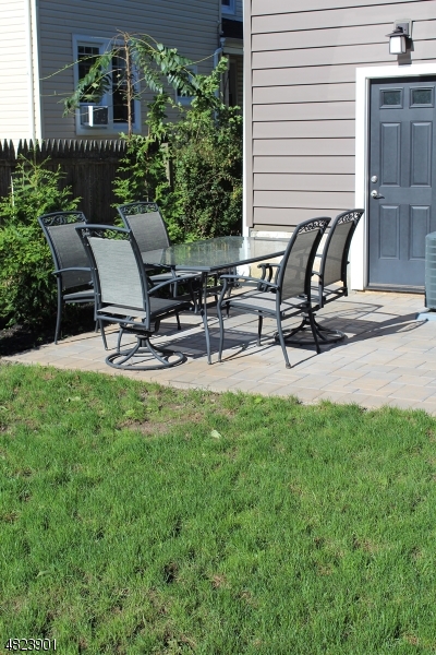 18 William Street, Unit 2 Summit, NJ 07901 - Photo 14 of 15 a view of a backyard with sitting area and furniture