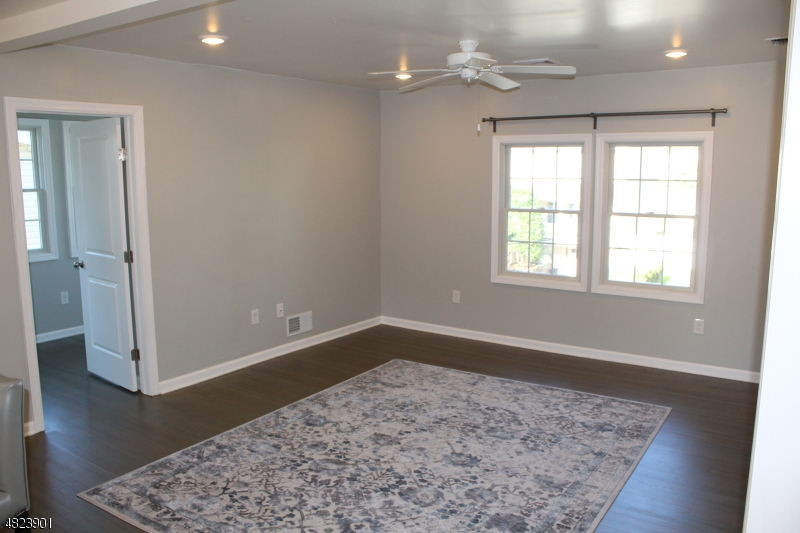 18 William Street, Unit 2 Summit, NJ 07901 - Photo 3 of 15 an empty room with wooden floor and windows