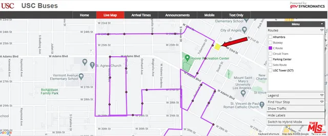 a picture of a kitchen with refrigerator and window