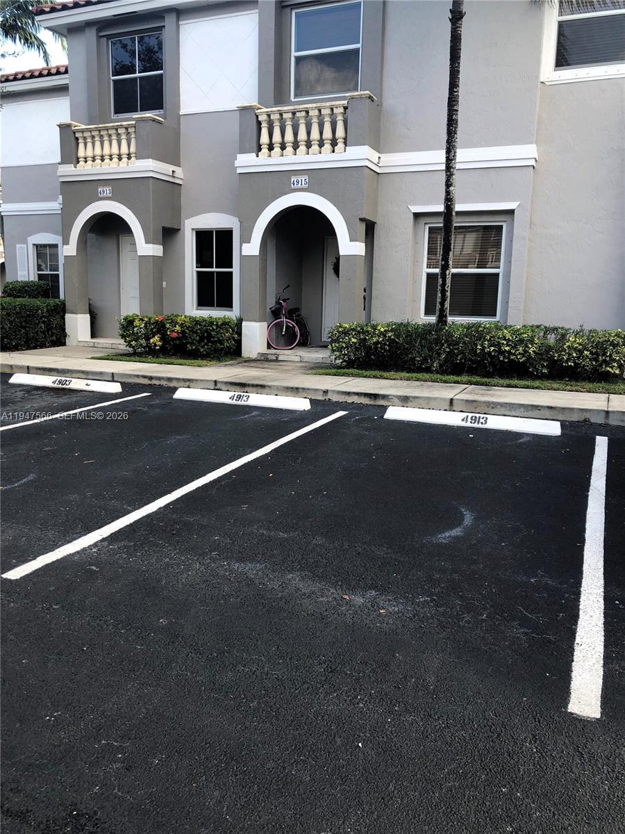 4913 Southwest 141st Avenue, Unit 2 Miramar, FL 33027 - Photo 3 of 12 a view of kitchen with granite countertop lots of windows and a sink