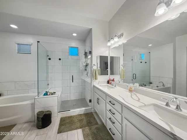 a spacious bedroom with a bed and a couch