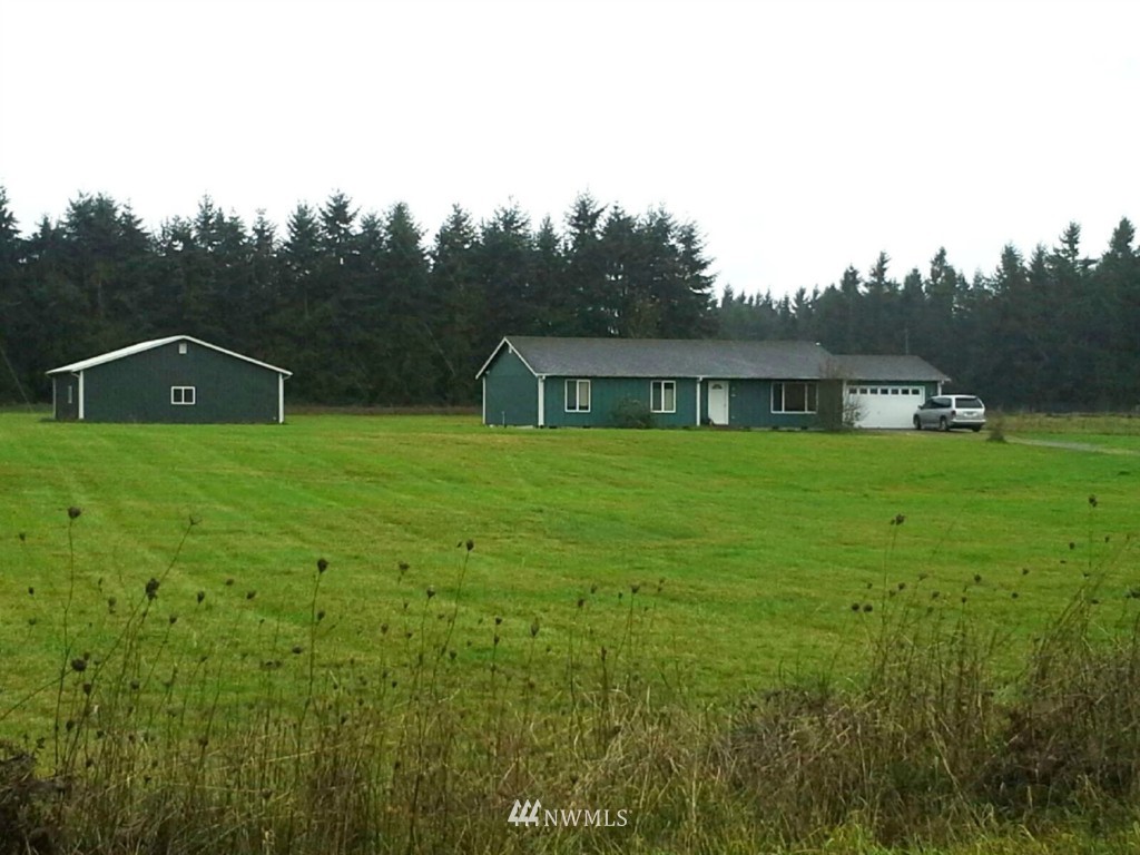 7325 187th Court Southwest Rochester, WA 98579 - Photo 1 of 9 a house view with a garden space