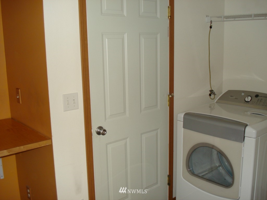 7325 187th Court Southwest Rochester, WA 98579 - Photo 7 of 9 a bathroom with a sink and a washer