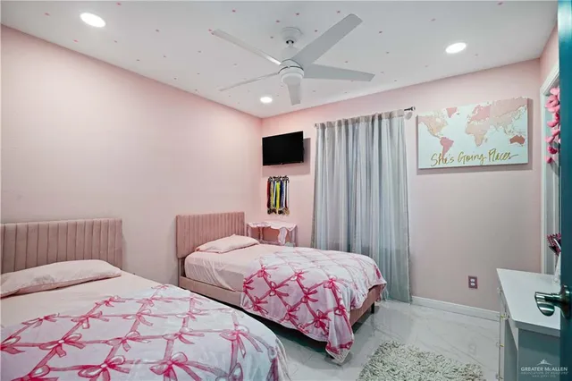 a bathroom with a sink vanity mirror and toilet