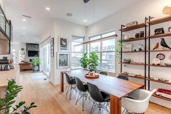 a dining room with furniture and window