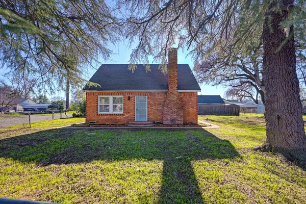 a view of a house with swimming pool and yard with green space
