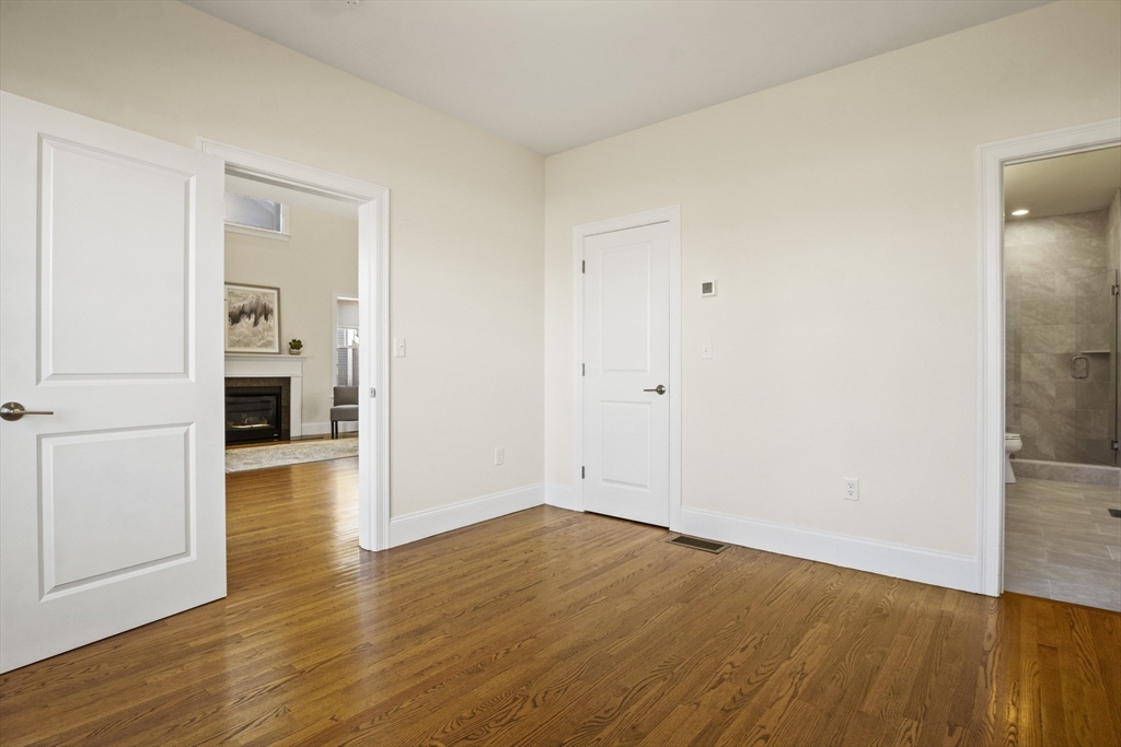 16 Winning Farm Road, Unit 16 Woburn, MA 01801 - Photo 15 of 42 a view of empty room with wooden floor