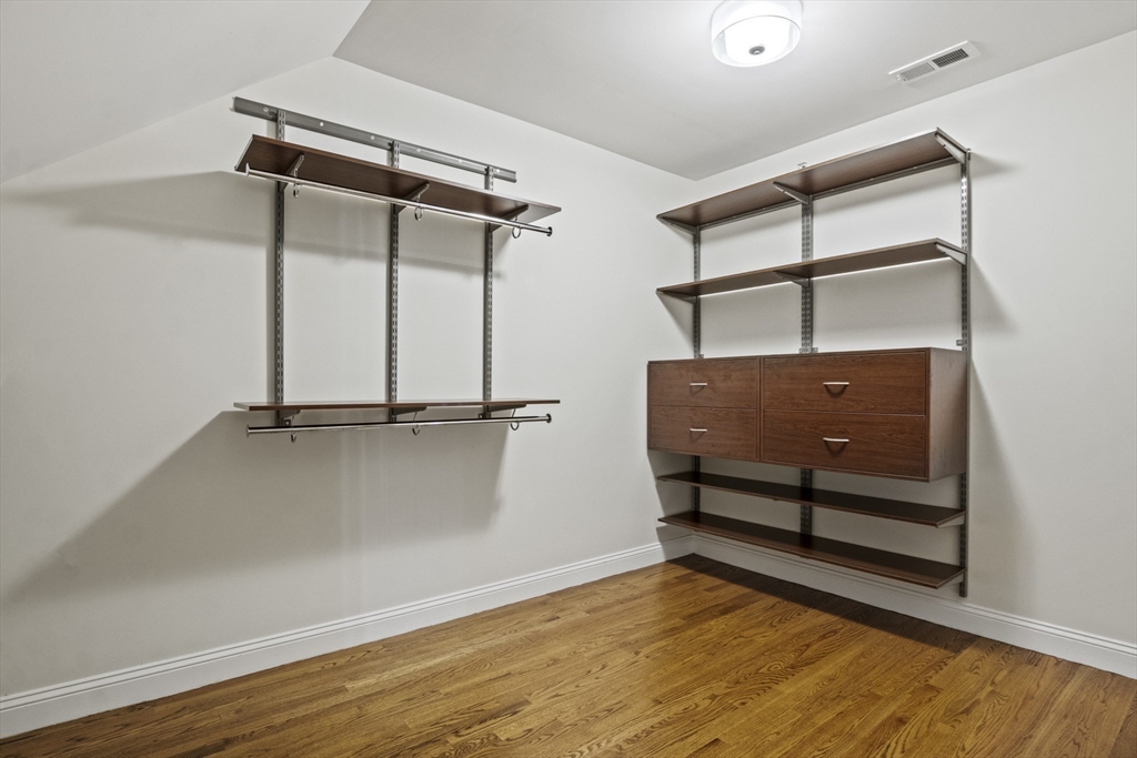 16 Winning Farm Road, Unit 16 Woburn, MA 01801 - Photo 25 of 42 a view of room with wooden floor and windows