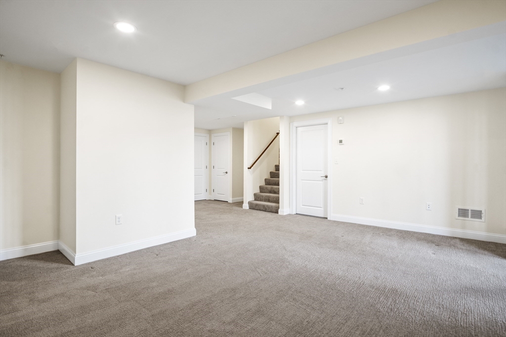 16 Winning Farm Road, Unit 16 Woburn, MA 01801 - Photo 28 of 42 an empty room with an entryway