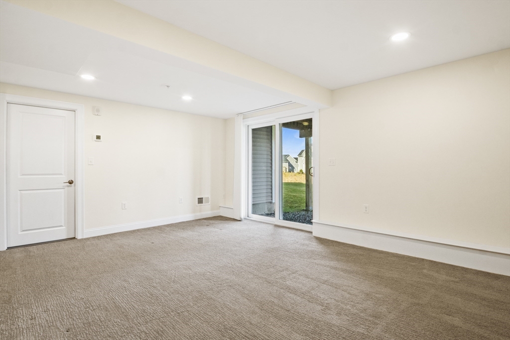 16 Winning Farm Road, Unit 16 Woburn, MA 01801 - Photo 29 of 42 a view of an empty room with a window