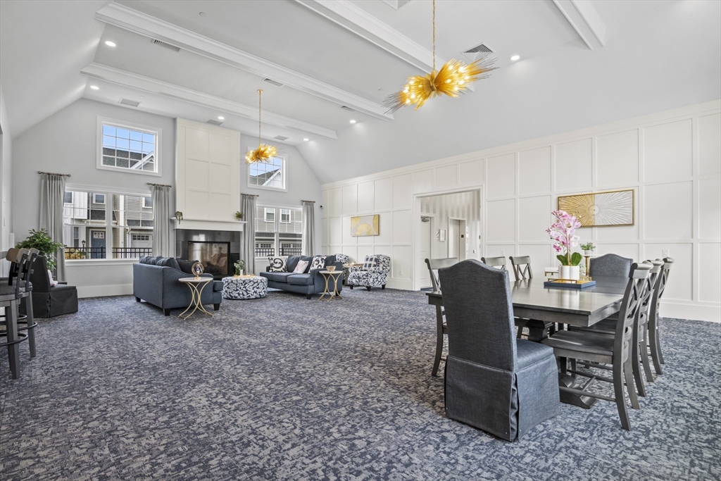 16 Winning Farm Road, Unit 16 Woburn, MA 01801 - Photo 37 of 42 a view of a livingroom with furniture and a flat screen tv