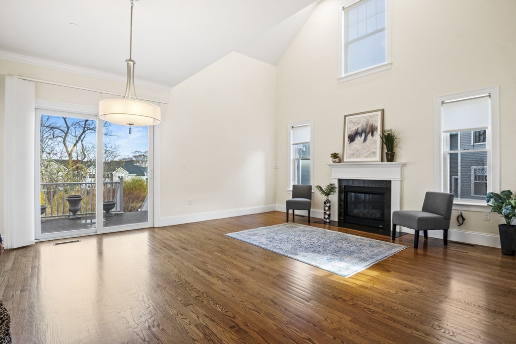 16 Winning Farm Road, Unit 16 Woburn, MA 01801 - Photo 5 of 42 a living room with furniture and a fireplace
