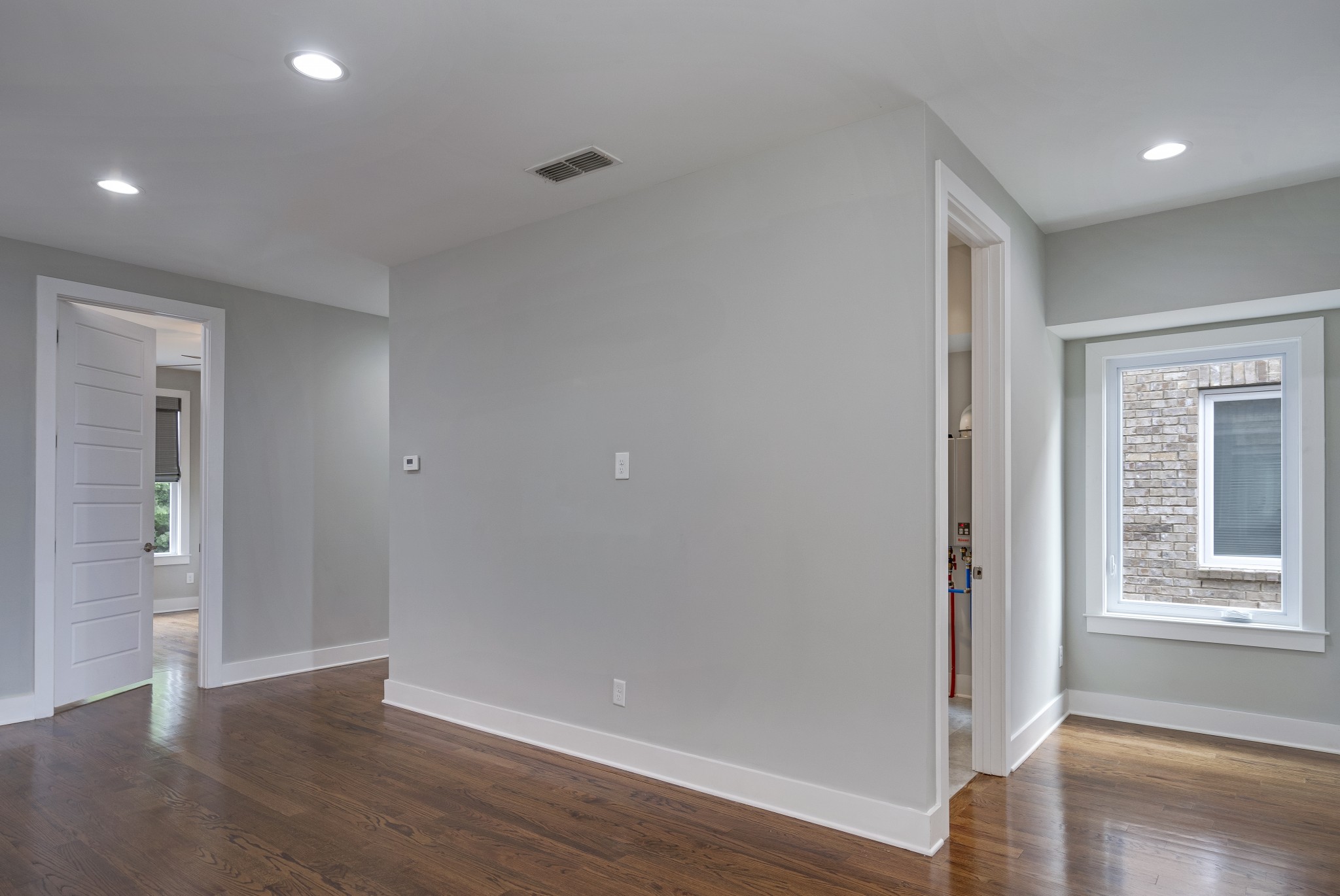 119 Demoss Road Nashville, TN 37209 - Photo 14 of 49 a view of an empty room with wooden floor and windows