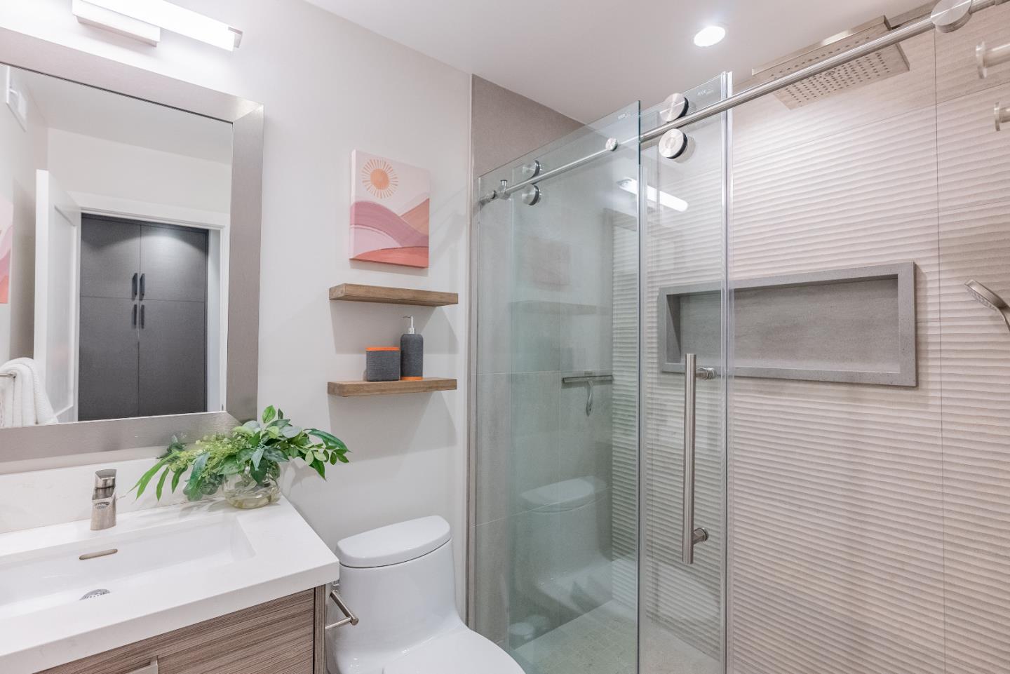 919 La Mesa Terrace, Unit E Sunnyvale, CA 94086 - Photo 20 of 34 a bathroom with a sink toilet and shower