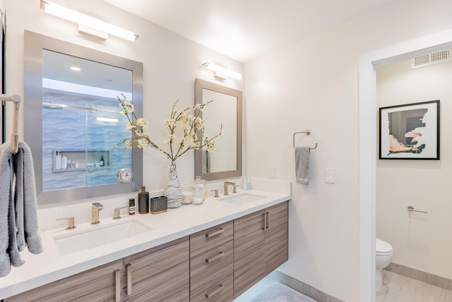 919 La Mesa Terrace, Unit E Sunnyvale, CA 94086 - Photo 26 of 34 a bathroom with a double vanity sink mirror and double