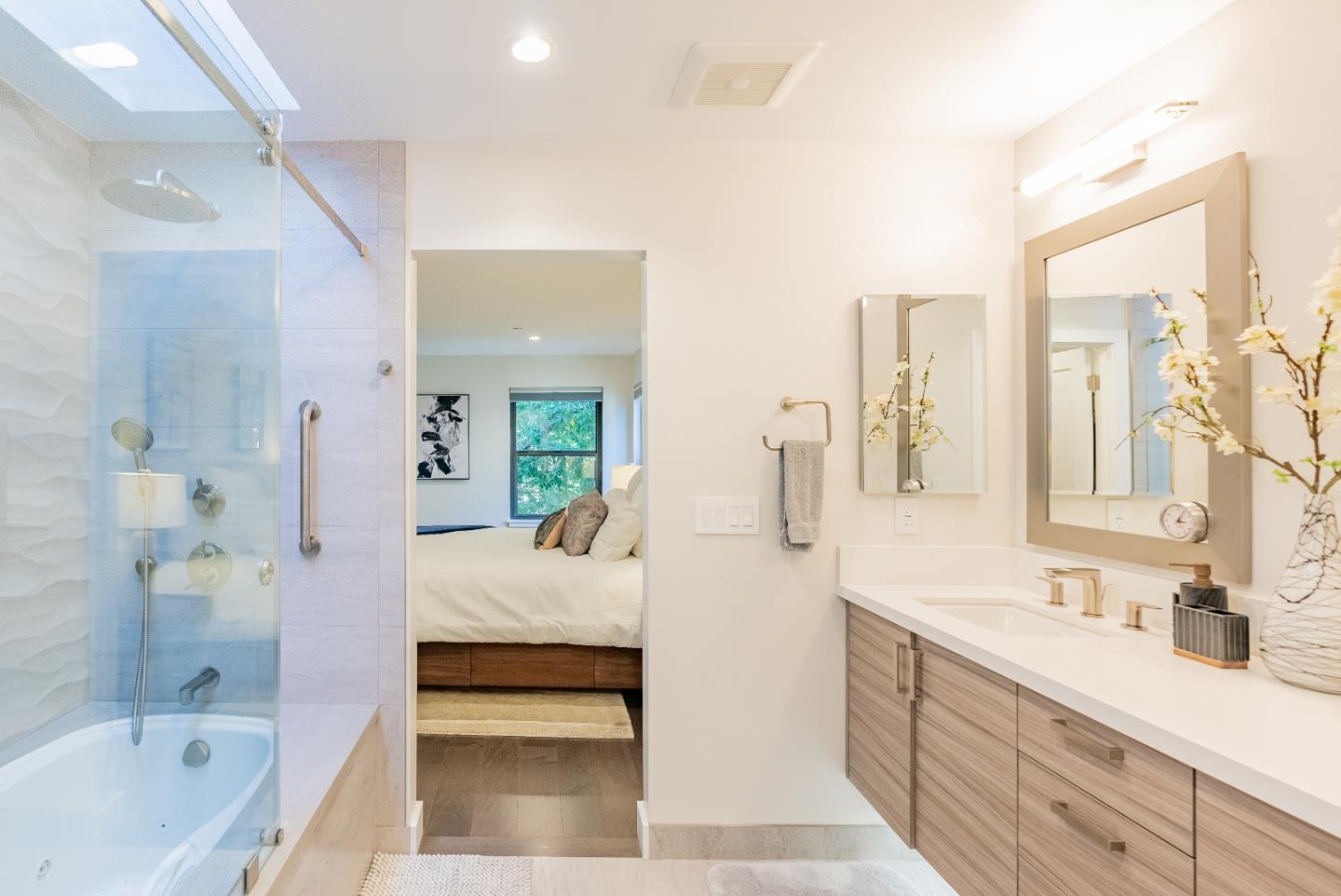 919 La Mesa Terrace, Unit E Sunnyvale, CA 94086 - Photo 27 of 34 a bathroom with a tub sink and mirror