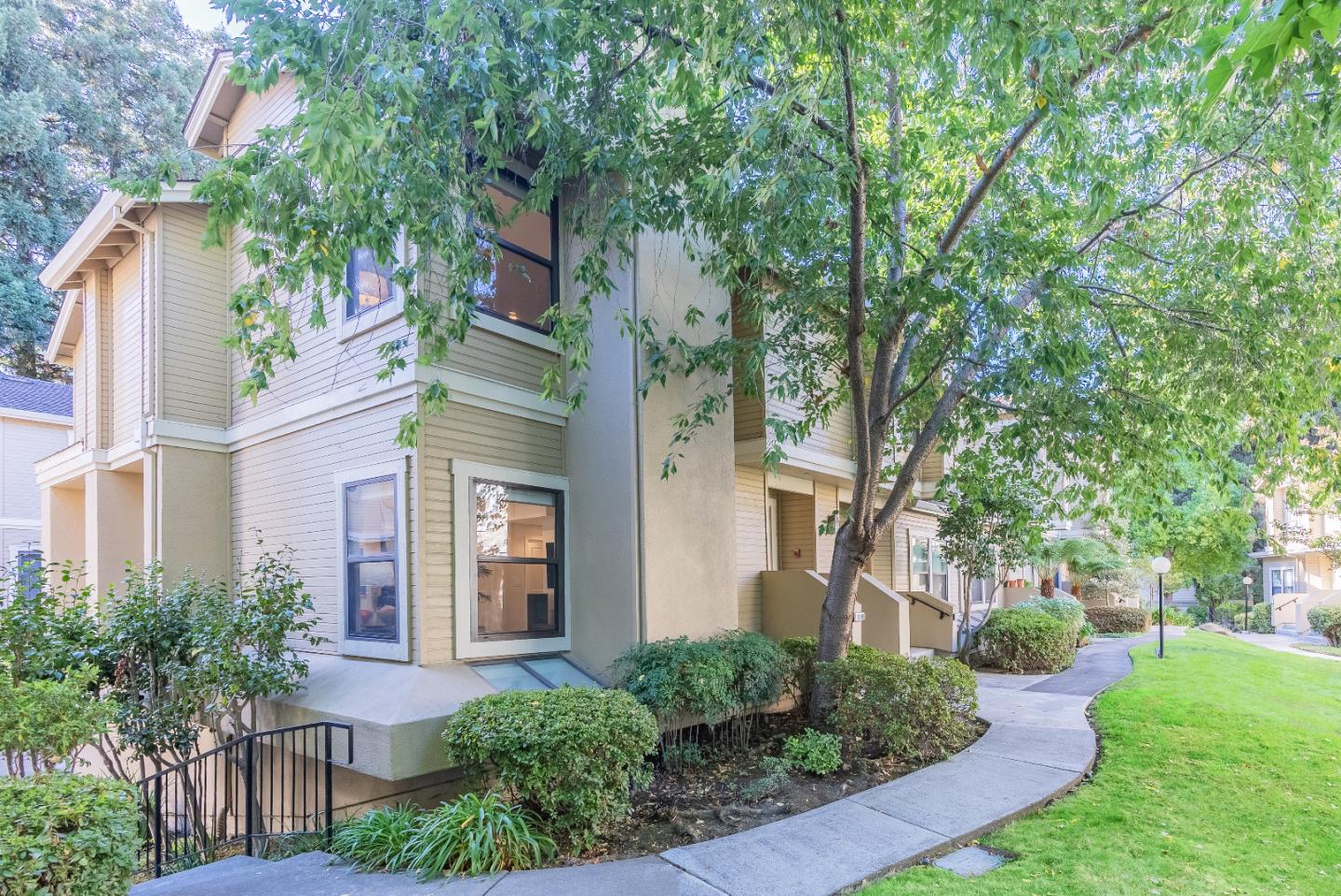 919 La Mesa Terrace, Unit E Sunnyvale, CA 94086 - Photo 34 of 34 a front view of a house with a yard
