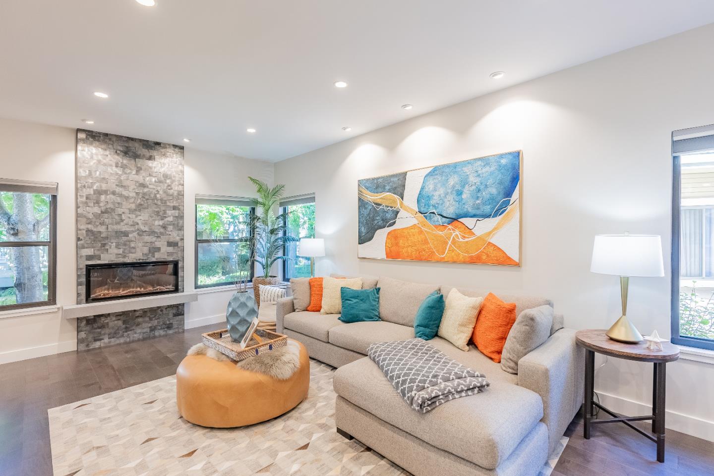 919 La Mesa Terrace, Unit E Sunnyvale, CA 94086 - Photo 4 of 34 a living room with furniture and a fireplace