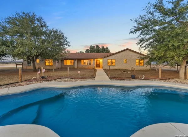 a view of outdoor space with swimming pool and patio