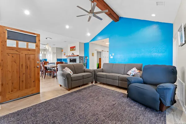a living room with furniture and a window