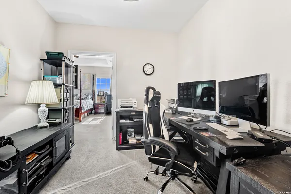 a view of a workspace with furniture