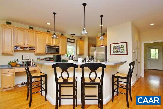 1029 Tilman Road Charlottesville, VA 22901 - Photo 11 of 33 a very nice looking kitchen with furniture and a chandelier
