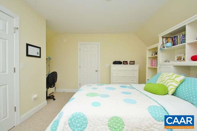 1029 Tilman Road Charlottesville, VA 22901 - Photo 27 of 33 a bedroom with a bed and a chair