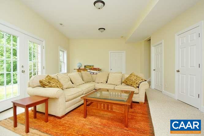1029 Tilman Road Charlottesville, VA 22901 - Photo 31 of 33 a living room with furniture and a large window