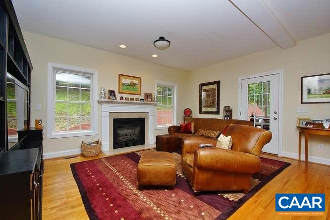 1029 Tilman Road Charlottesville, VA 22901 - Photo 10 of 33 a living room with furniture and a fireplace